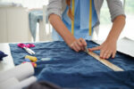 close-up-seamstress-working-with-measuring-tape_171337-7349.jpg