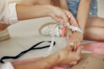 close-up-seamstress-working-with-measuring-tape_171337-7349.jpg