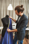 close-up-seamstress-working-with-measuring-tape_171337-7349.jpg